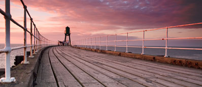 Photographs at Art Evolution include Whitby Pier at Sunset by Dave Hudspeth